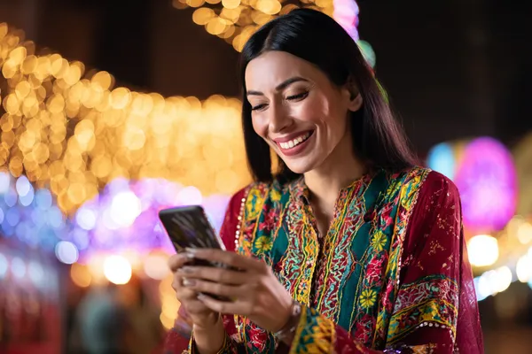 A glowing roulette wheel with cascading chips, symbolizing the engaging live and instant-win games available on BB444.